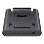 A three-quarter frontal view of a black GPD WIN 5 docking station, isolated against a black background. The dock features an array of ports on the front edge, including USB-C, USB-A, and an RJ45 Ethernet port. The recessed top area is designed to hold the GPD WIN 5 and includes a connector for charging and data.