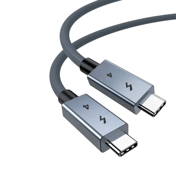 DROIX-USB-4-CABLE-LISTING-DONE-01 A close-up of a high-quality USB-4 cable featuring two USB-C connectors with space-grey metallic housings. The connectors are engraved with a lightning bolt icon and the number "4." The cable itself has a durable, grey braided nylon jacket, shown curved against a plain white background.